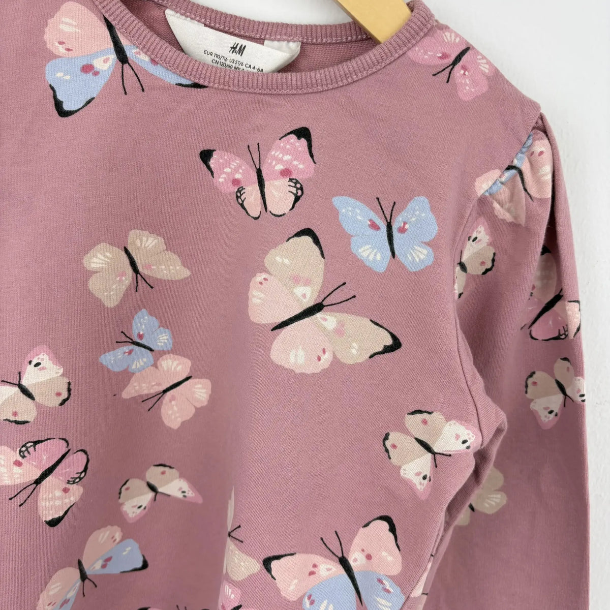 H&M pillangós mintás pulóver 110 116 rózsaszín – minta közelről